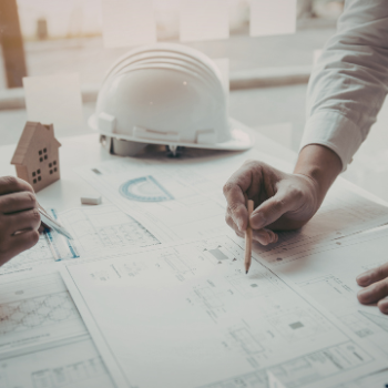 Building surveyor reviewing plans